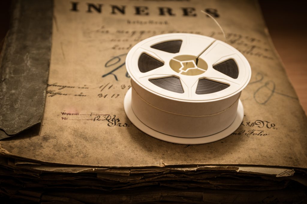 Closeup shot of microfilm and aged archives